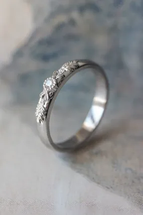 White gold wedding band with three diamonds, wreath ring